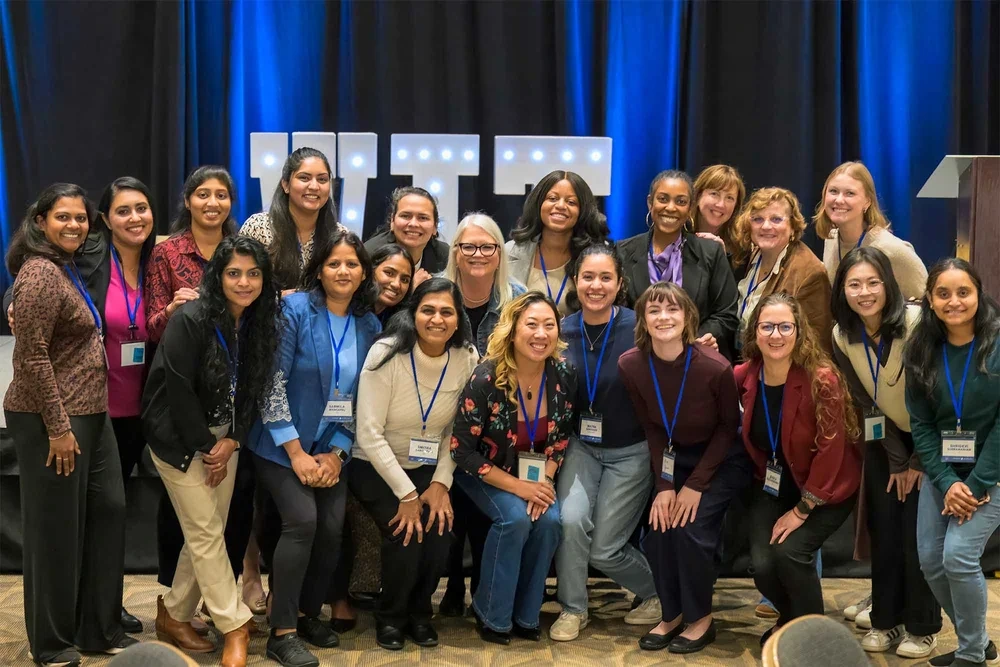 Corporate event group photo by Deborah Heinlen Photography, Cincinnati — large diverse group of professional women with name badges at a business conference