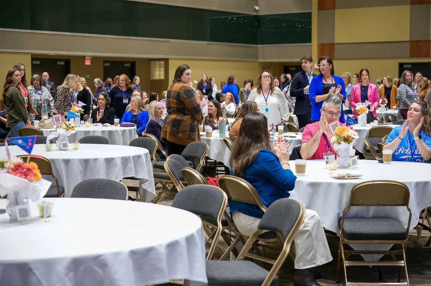 Corporate event photography by Deborah Heinlen Photography, Cincinnati — large conference room filled with attendees seated at round tables