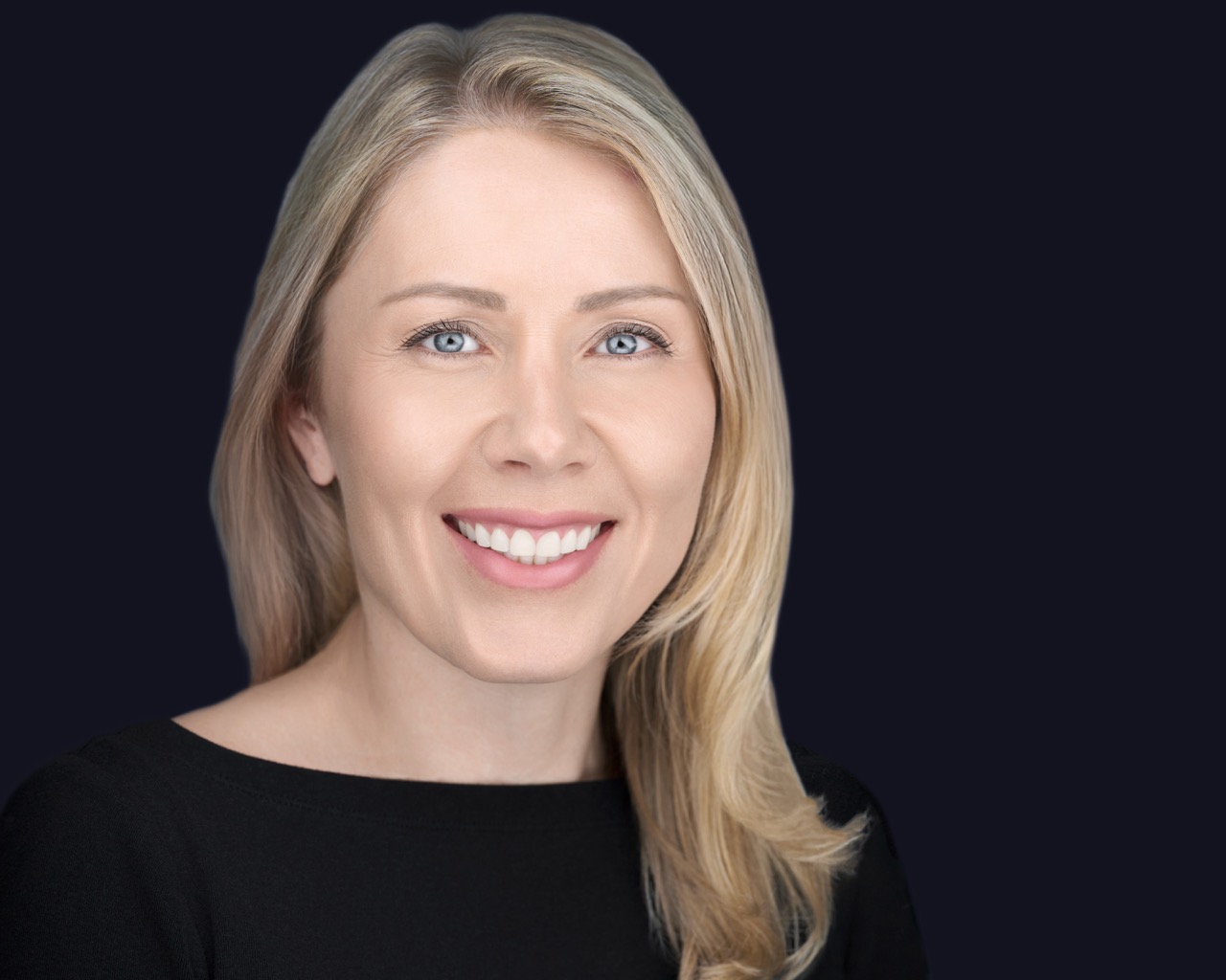 Professional headshot of a smiling business professional photographed by Deborah Heinlen in Cincinnati