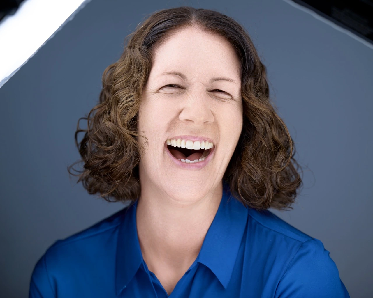Deborah Heinlen Photography client laughing during a natural, relaxed headshot session in Cincinnati