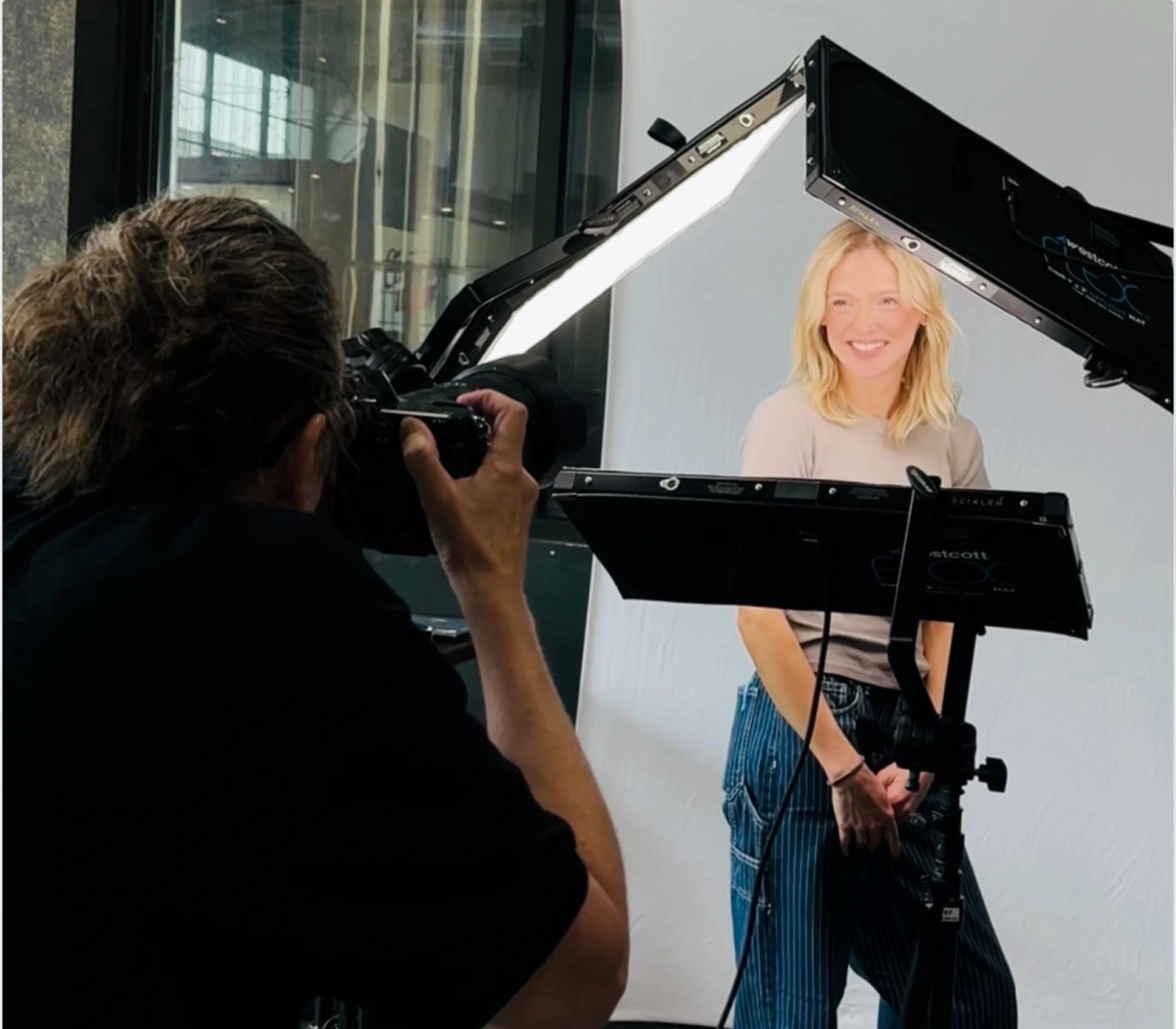 Deborah Heinlen Photography photographing a corporate headshot session on-site in Greater Cincinnati — professional lighting setup with female subject