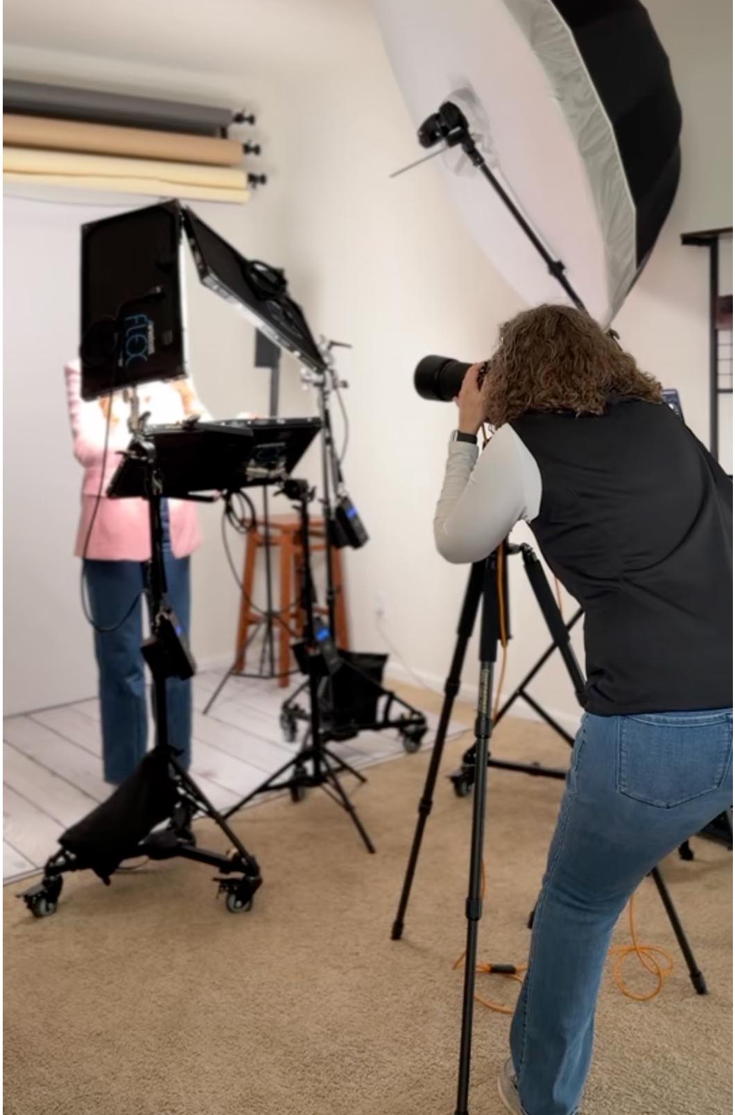 Deborah Heinlen photographing a client in her Hebron Kentucky studio