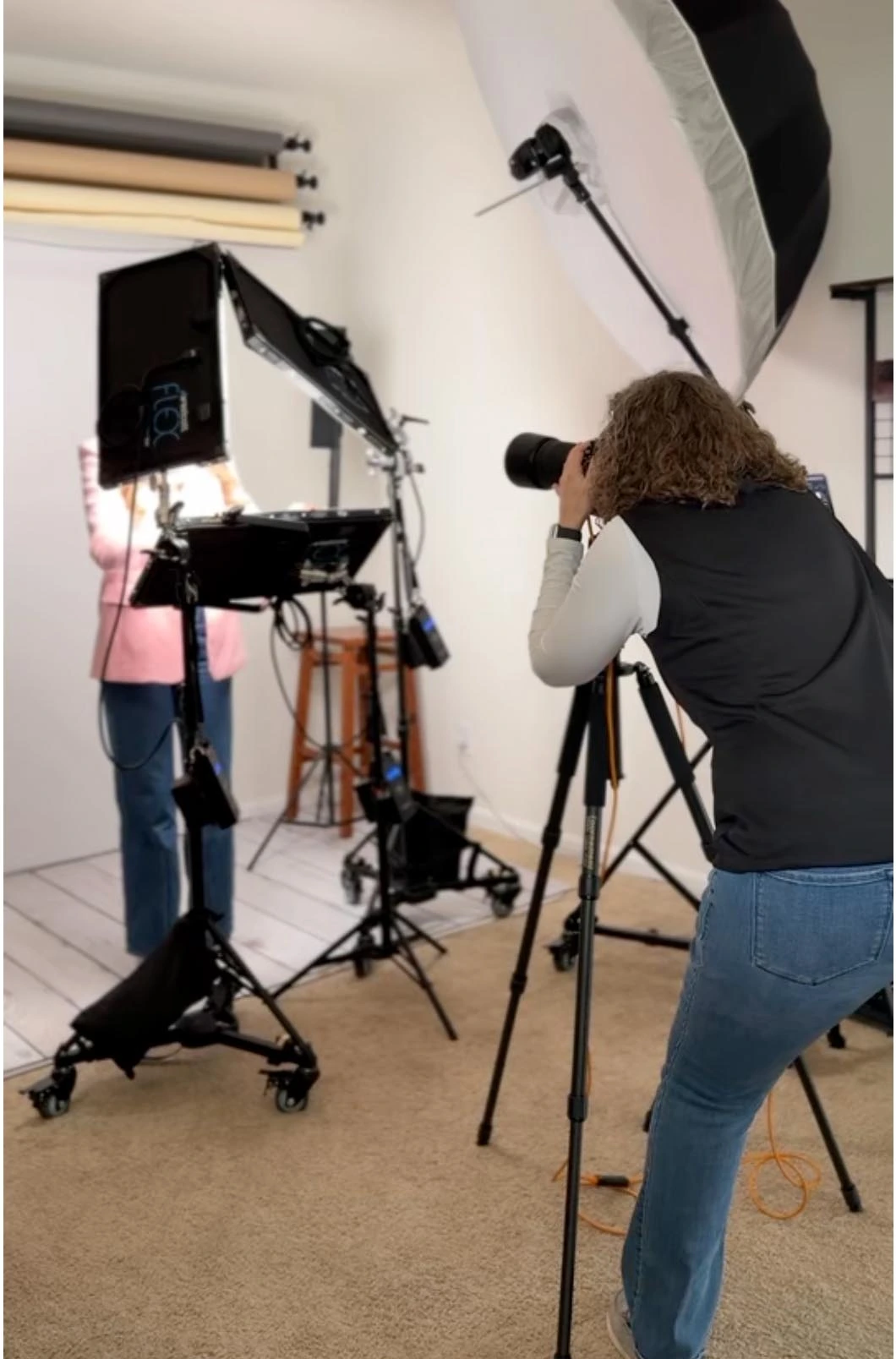 Behind the scenes of a Deborah Heinlen Photography headshot session in Hebron, Kentucky — photographer working with professional studio lighting and backdrop setup